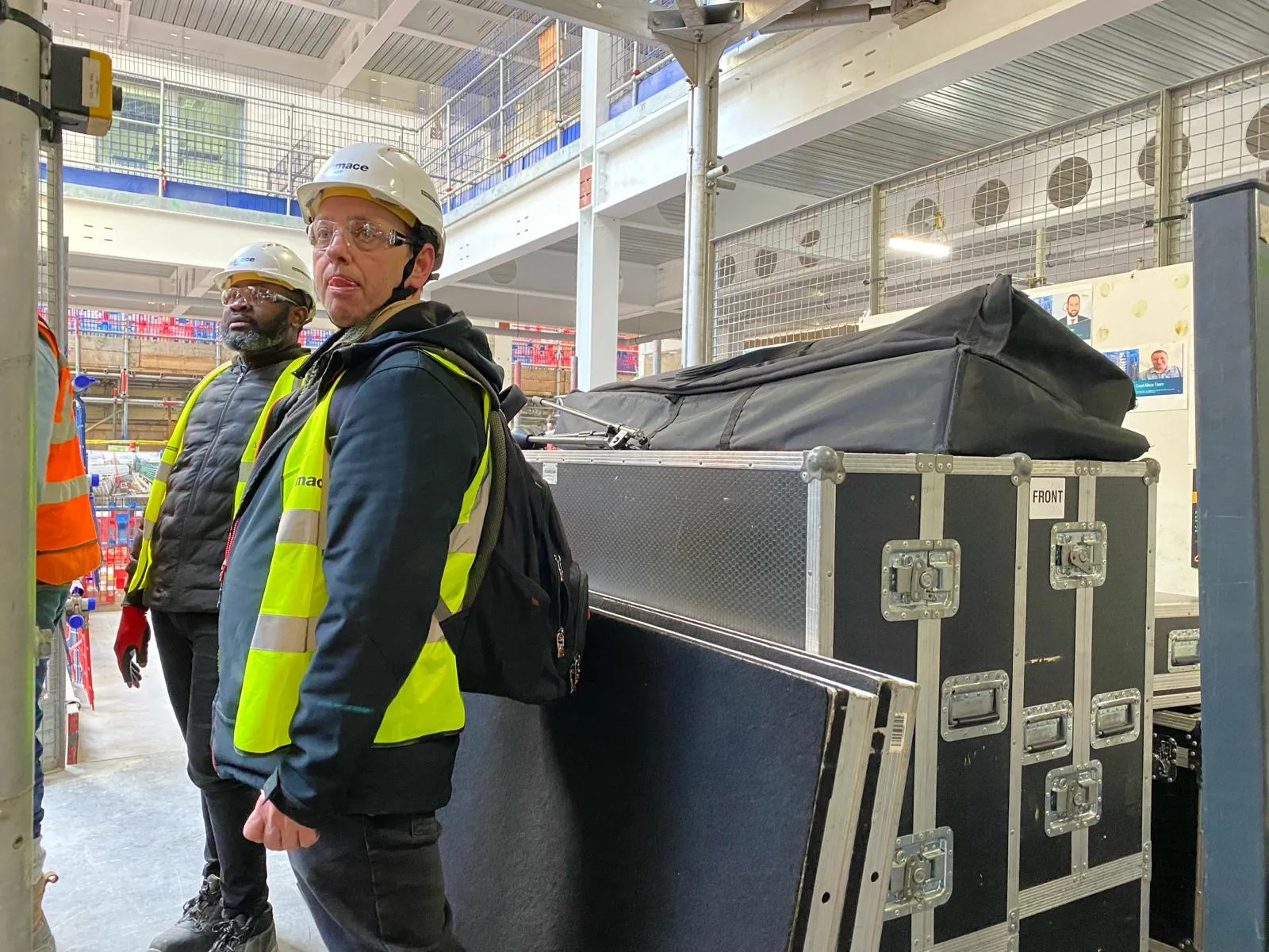 EMS Events crew moving AV flight cases through Stonecutter Court