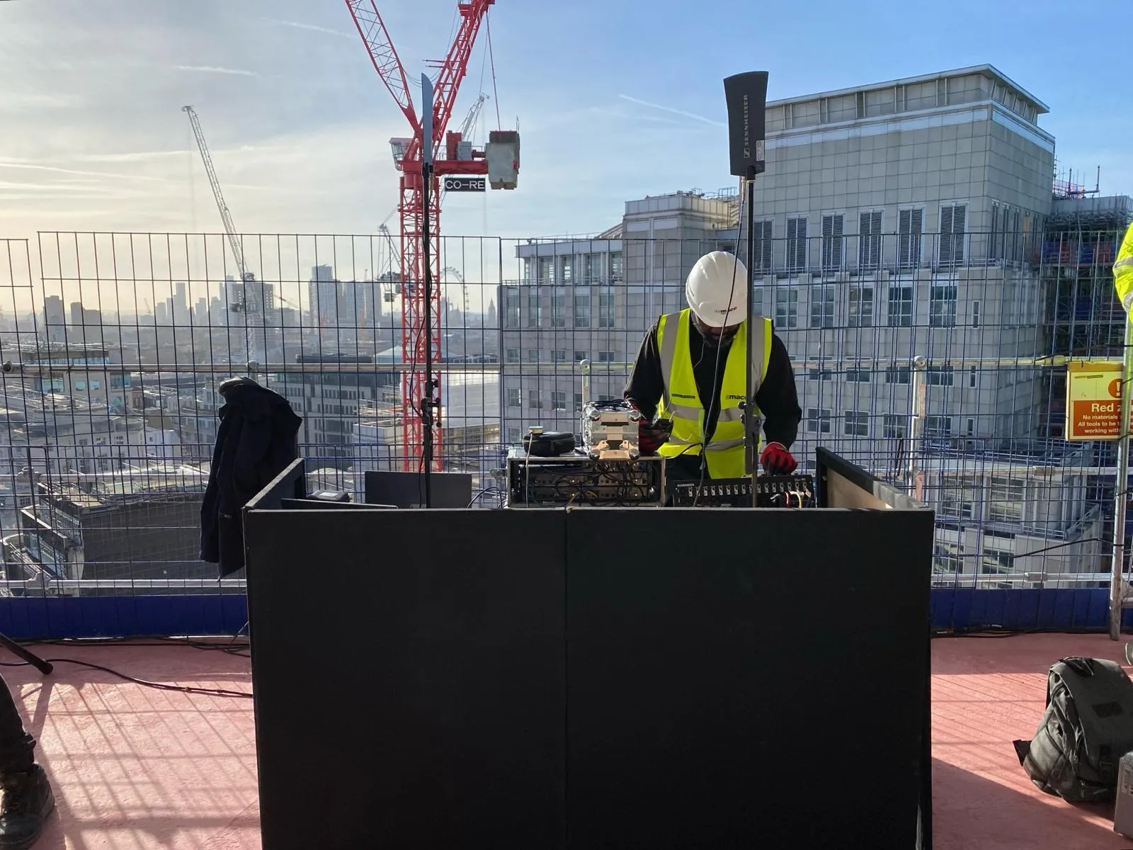 EMS Events sound engineer mixing audio on Stonecutter Court rooftop