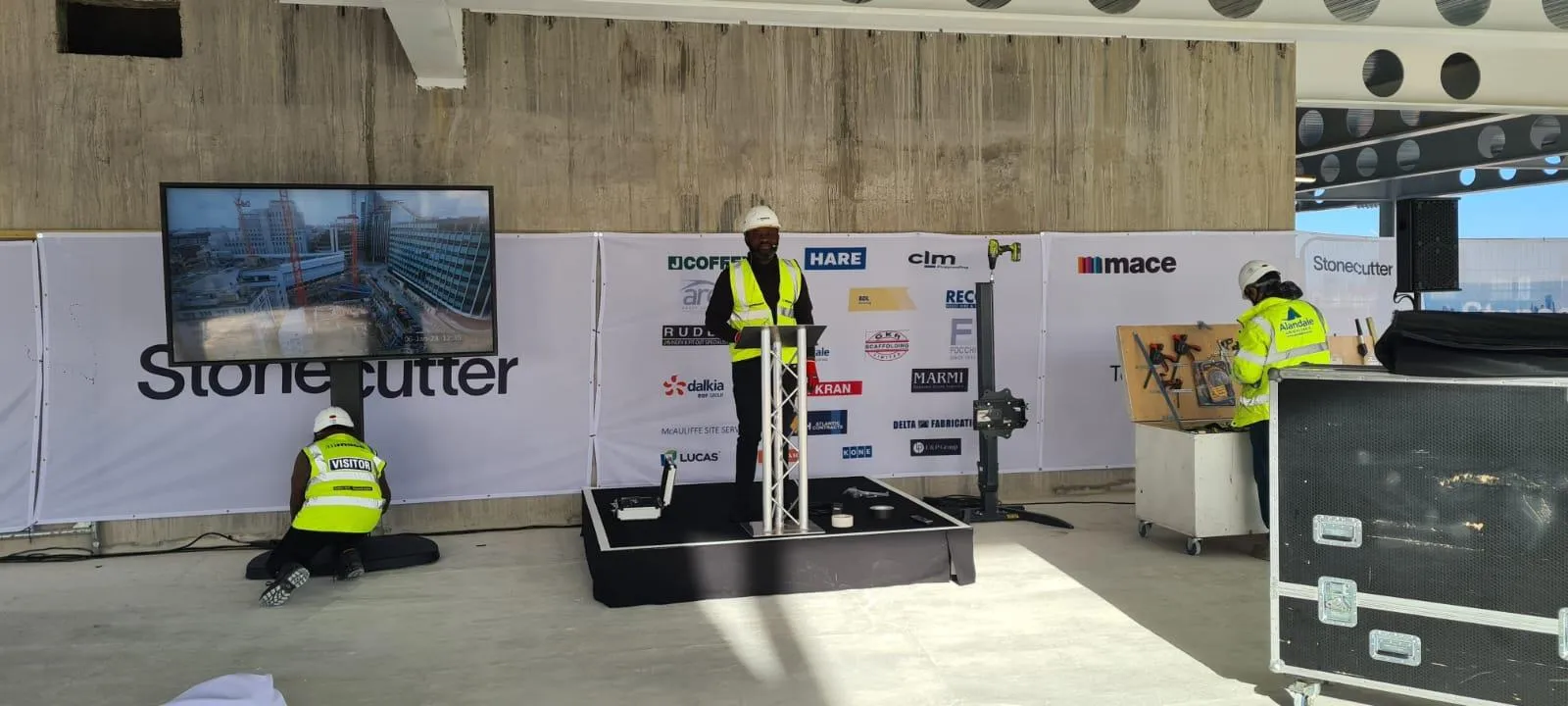 Indoor stage rehearsal at Mace Stonecutter Court topping-out ceremony