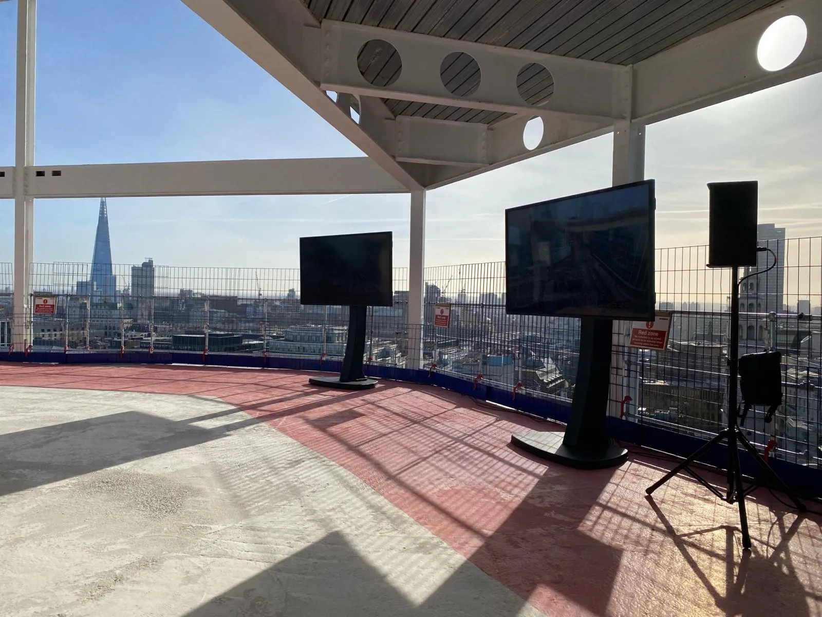 Twin display screens at Mace Stonecutter Court topping-out ceremony