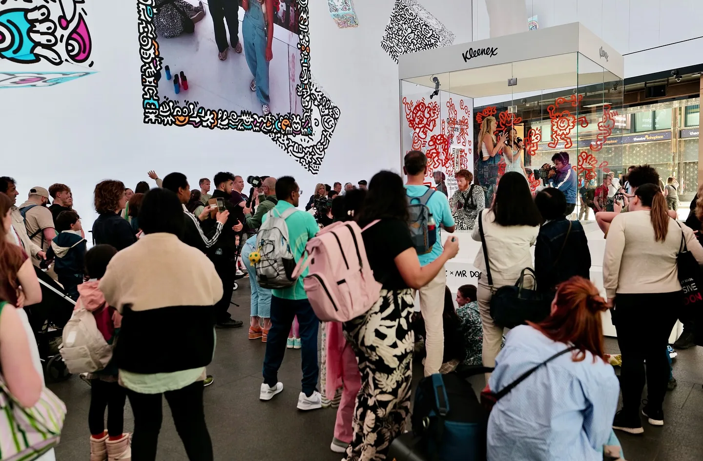TikTok livestream presenters and crowd at Kleenex x Mr Doodle Outernet London