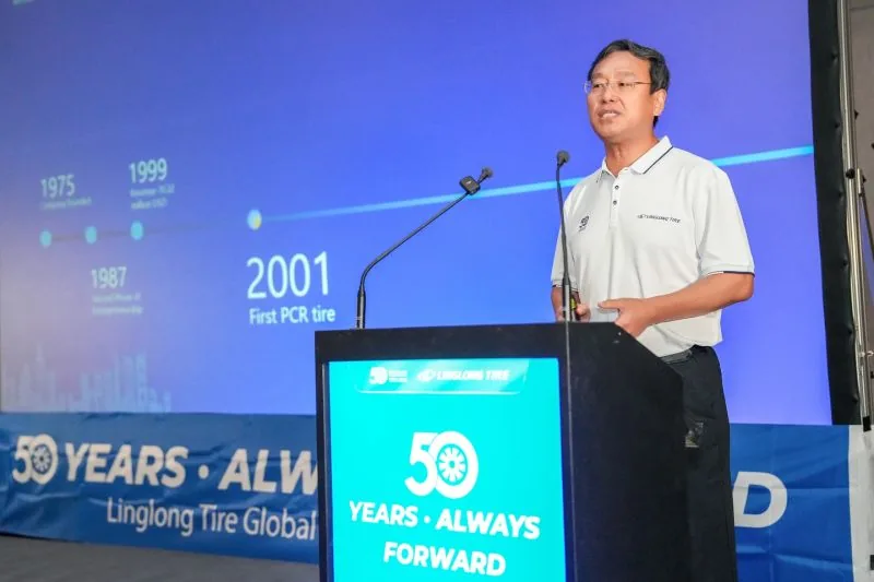 Linglong Tire executive presenting 50-year milestone timeline in London