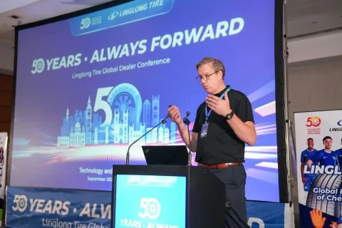Speaker presenting at Linglong Tire Global Dealer Conference London 2025