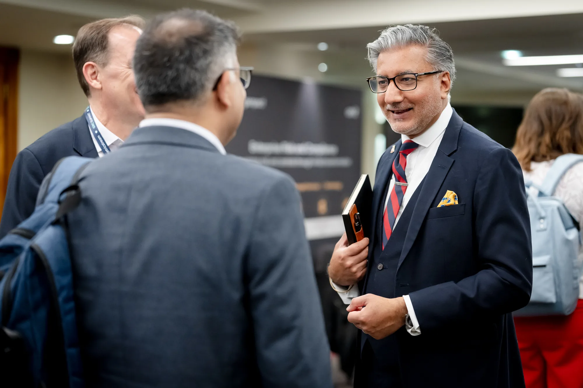 attendee-networking-conference-foyer-grc-summit-london-2026