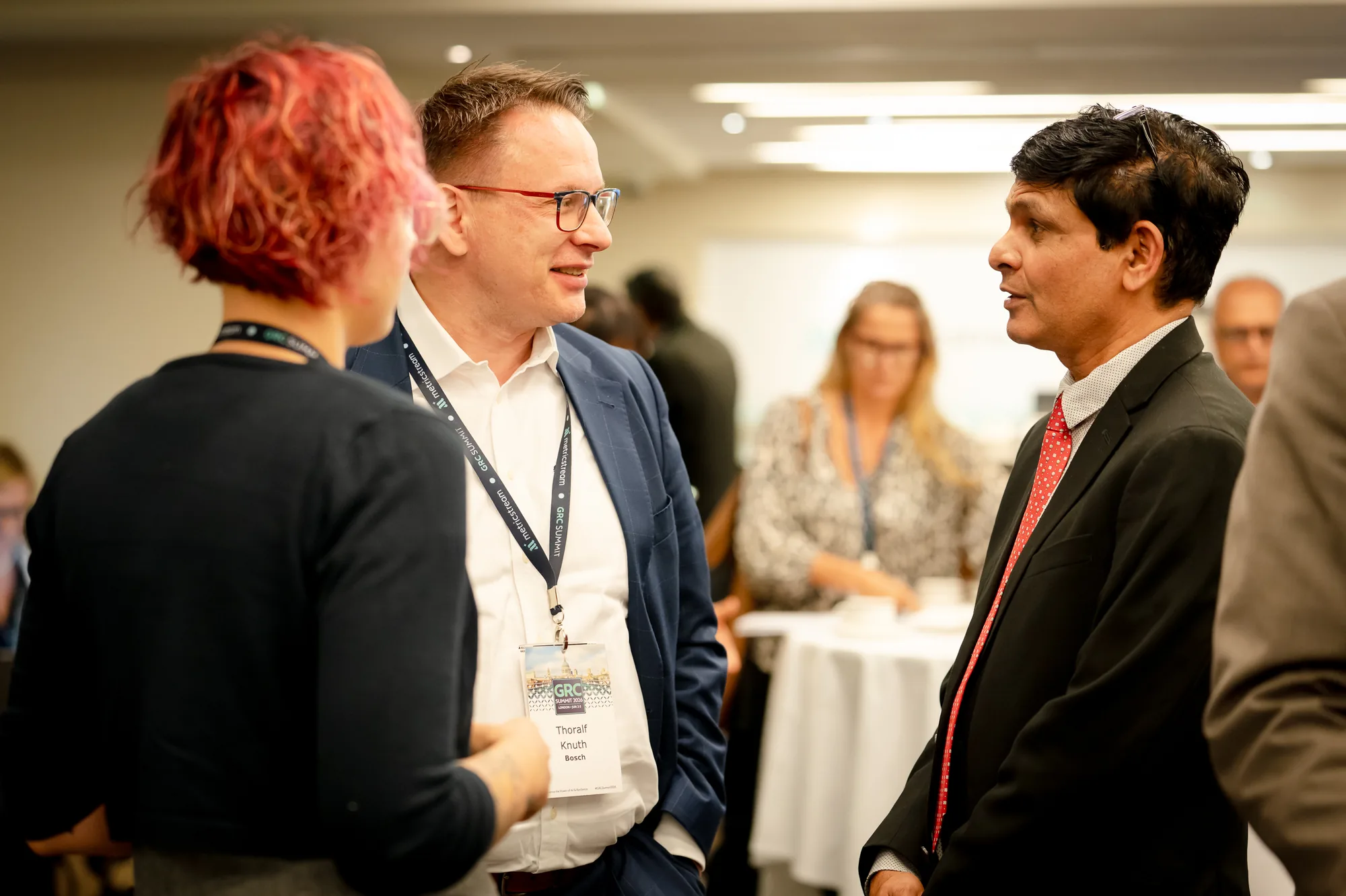 attendees-networking-standing-tables-grc-summit-2026