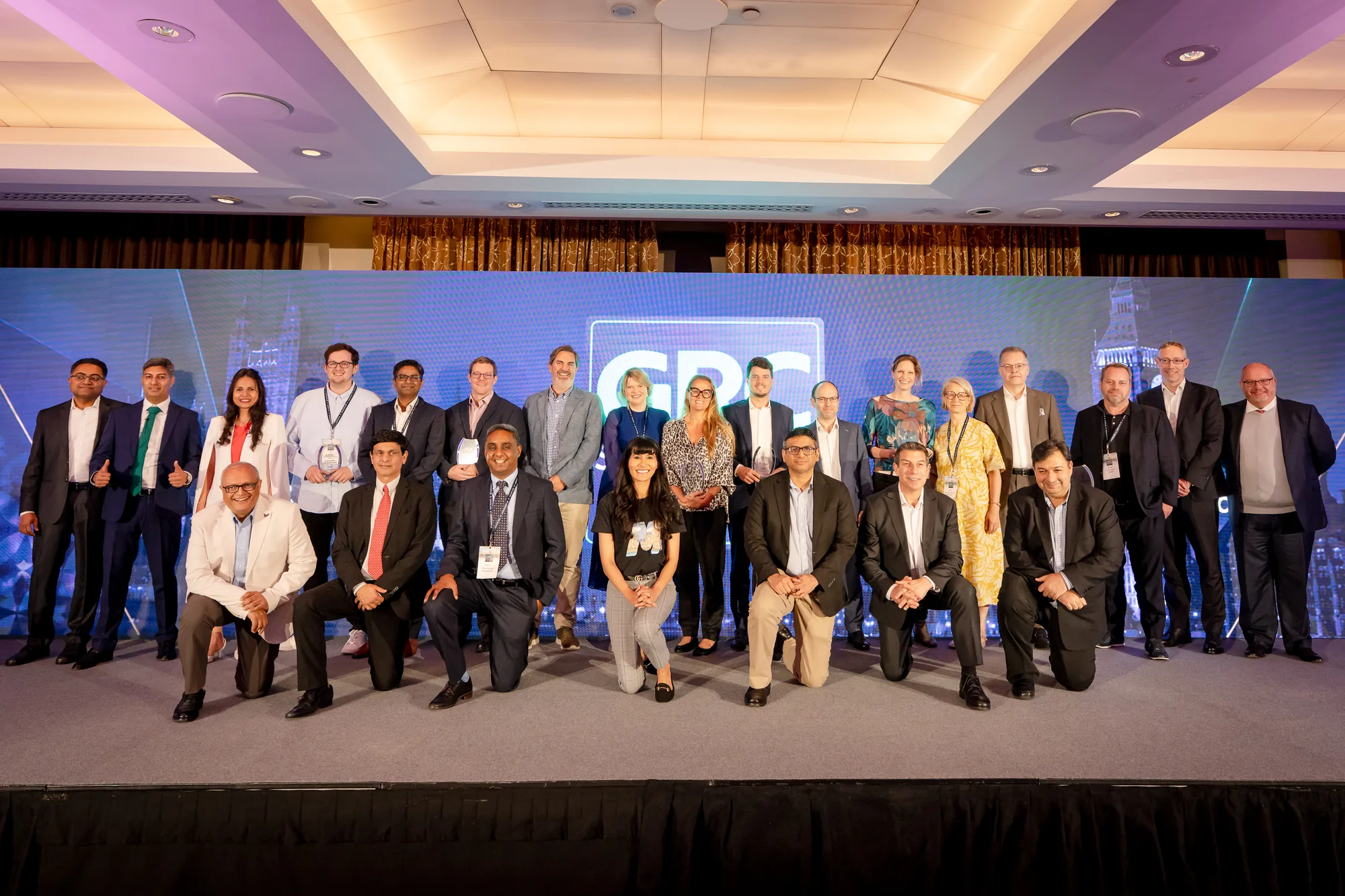 group-photo-stage-led-video-wall-grc-summit-london-2026