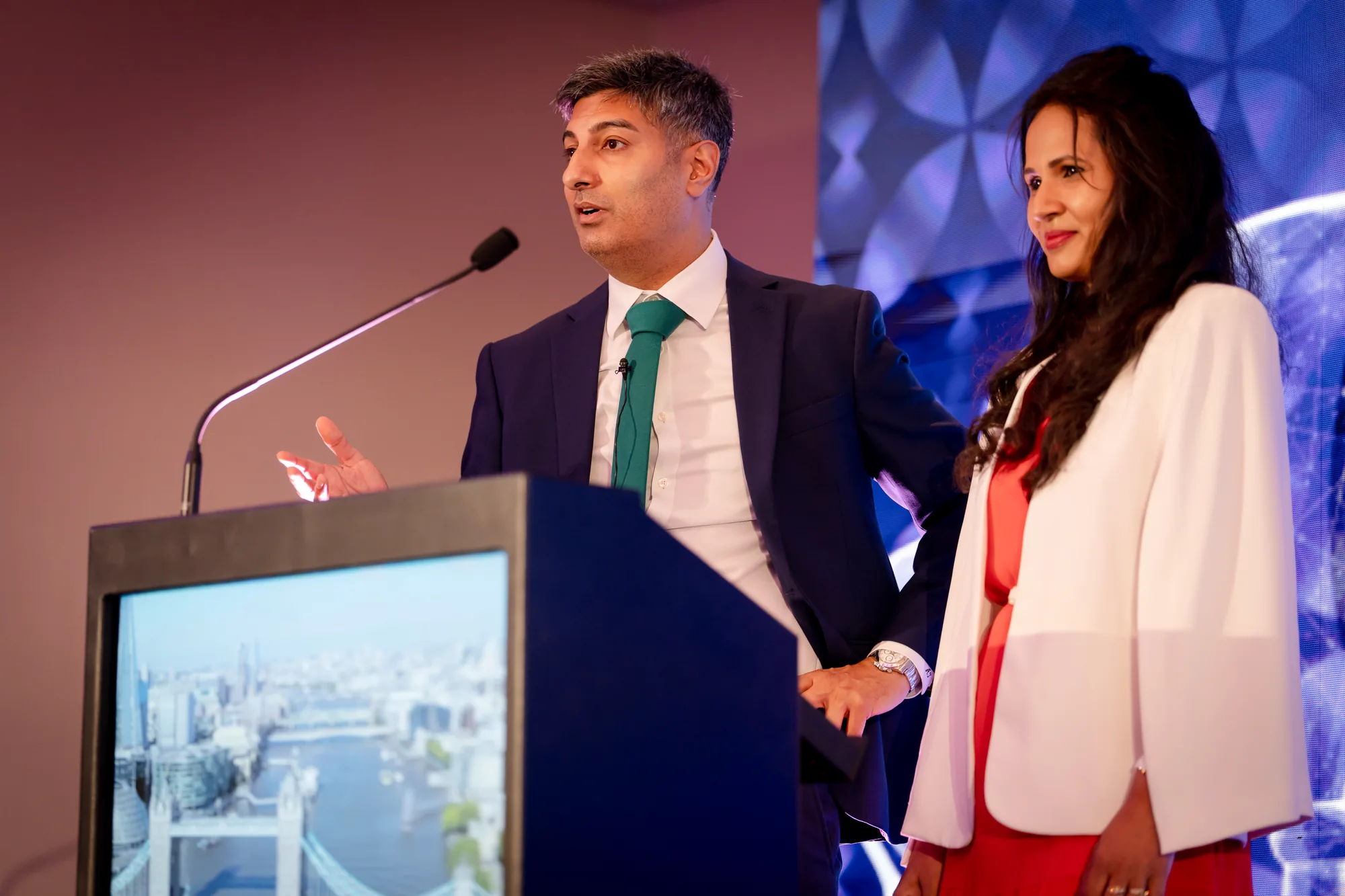 hosts-lectern-stage-opening-grc-summit-royal-garden-hotel