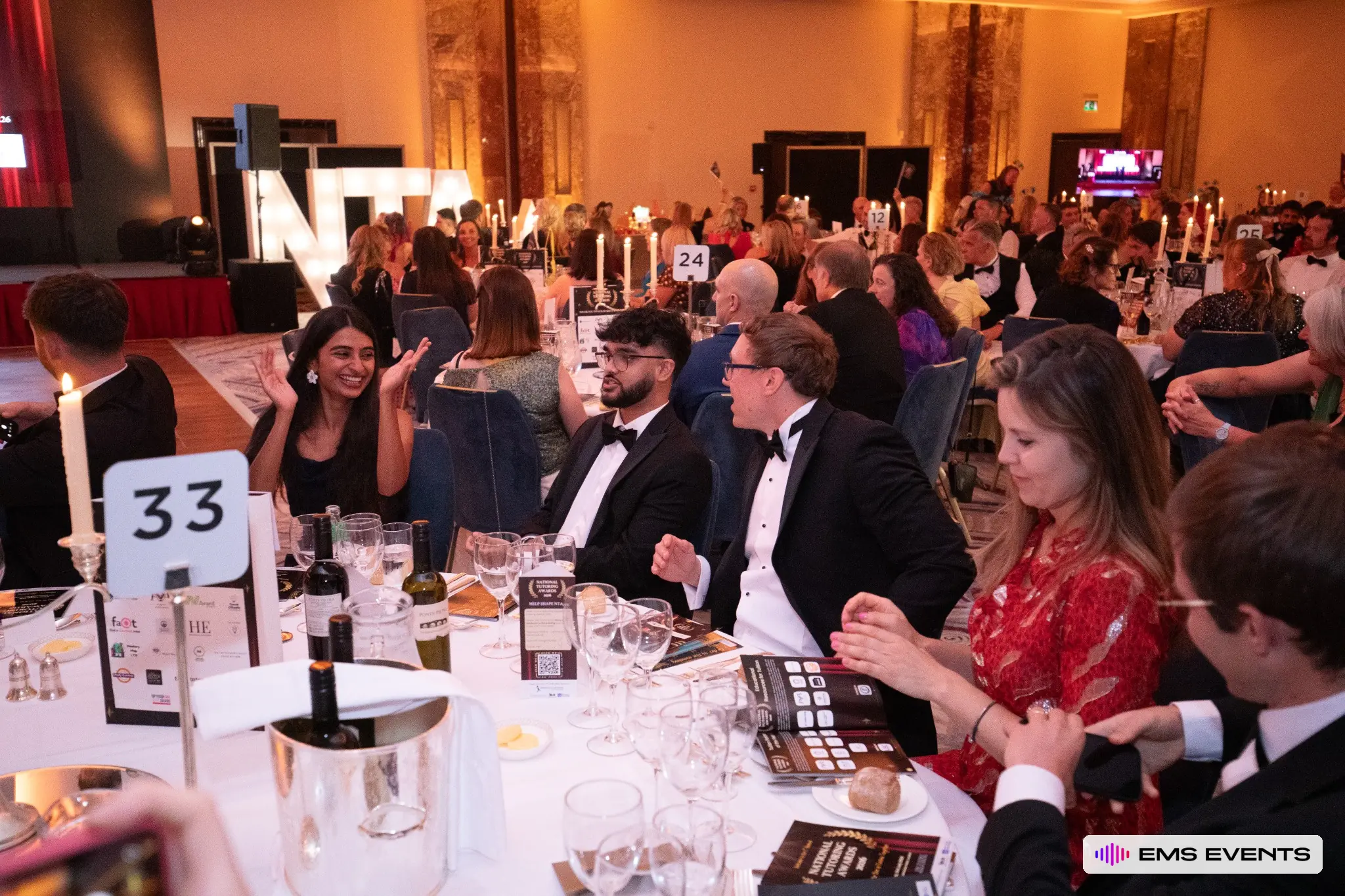 Guests share laughter at their table during the 5th National Tutoring Awards ceremony at Royal Lancaster London
