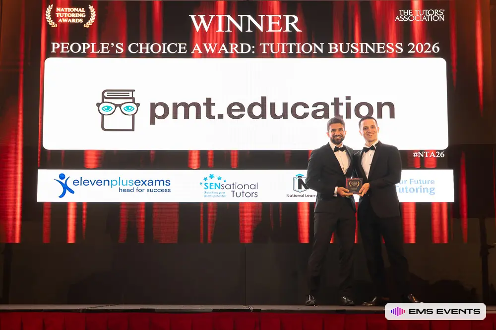 PMT Education team receive the People's Choice Award: Tuition Business 2026 on stage with their trophy