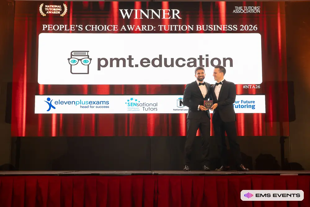 PMT Education founders pose with their People's Choice Award trophy on the 5th National Tutoring Awards stage
