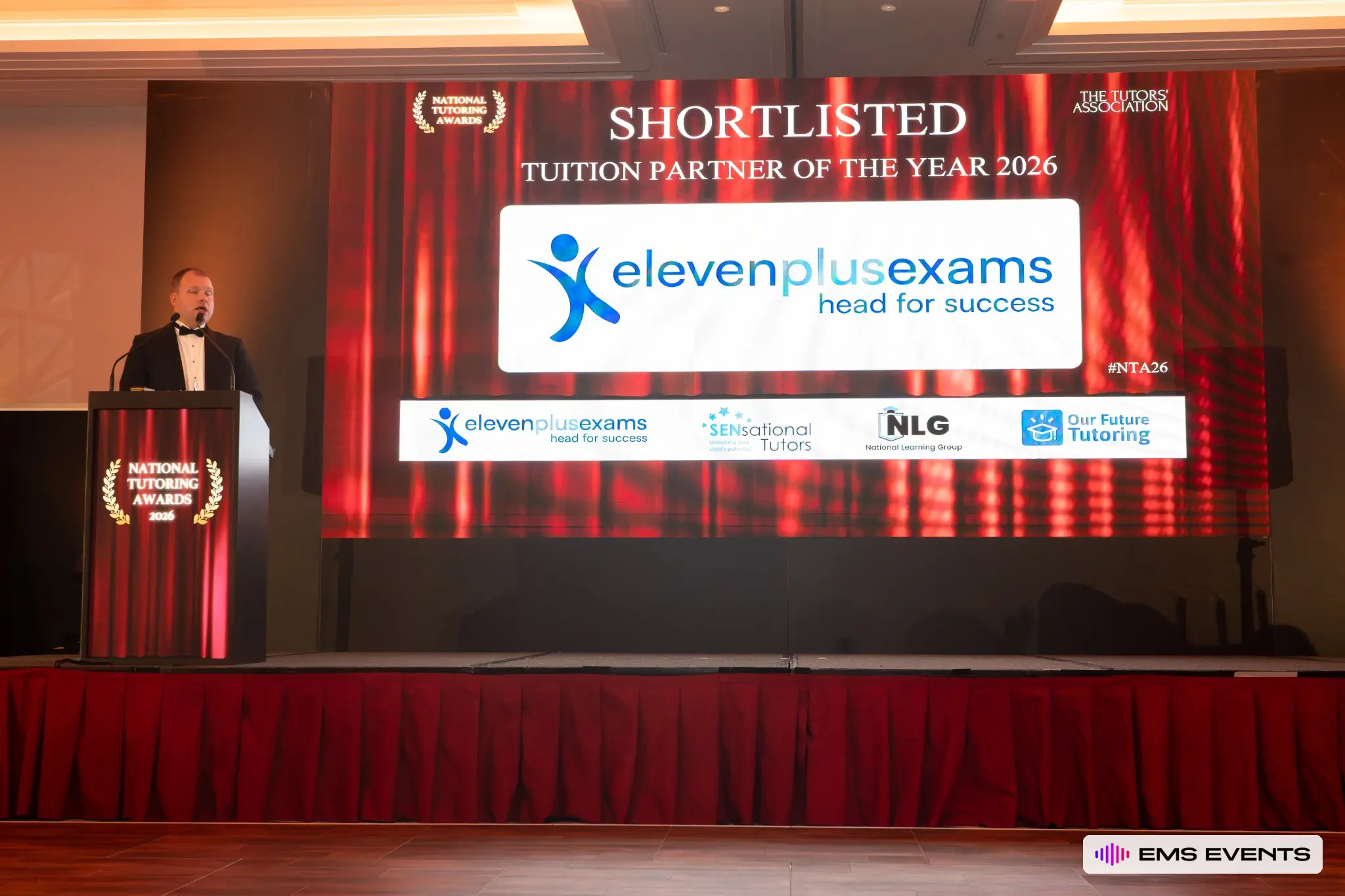 Full stage view with the Tuition Partner of the Year 2026 shortlist displayed on the LED screen, produced by EMS Events