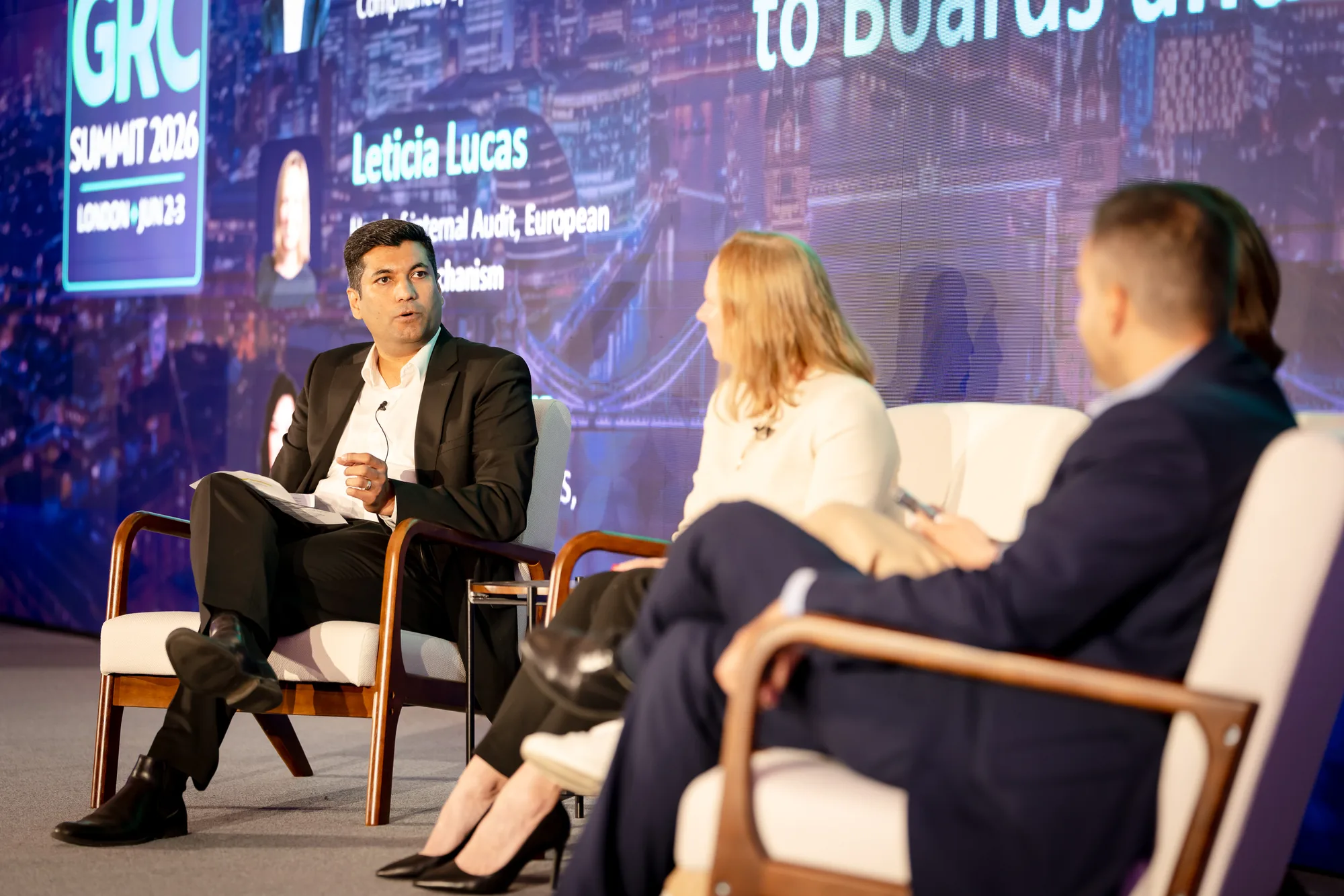 panel-discussion-speaker-graphic-led-wall-grc-summit-2026