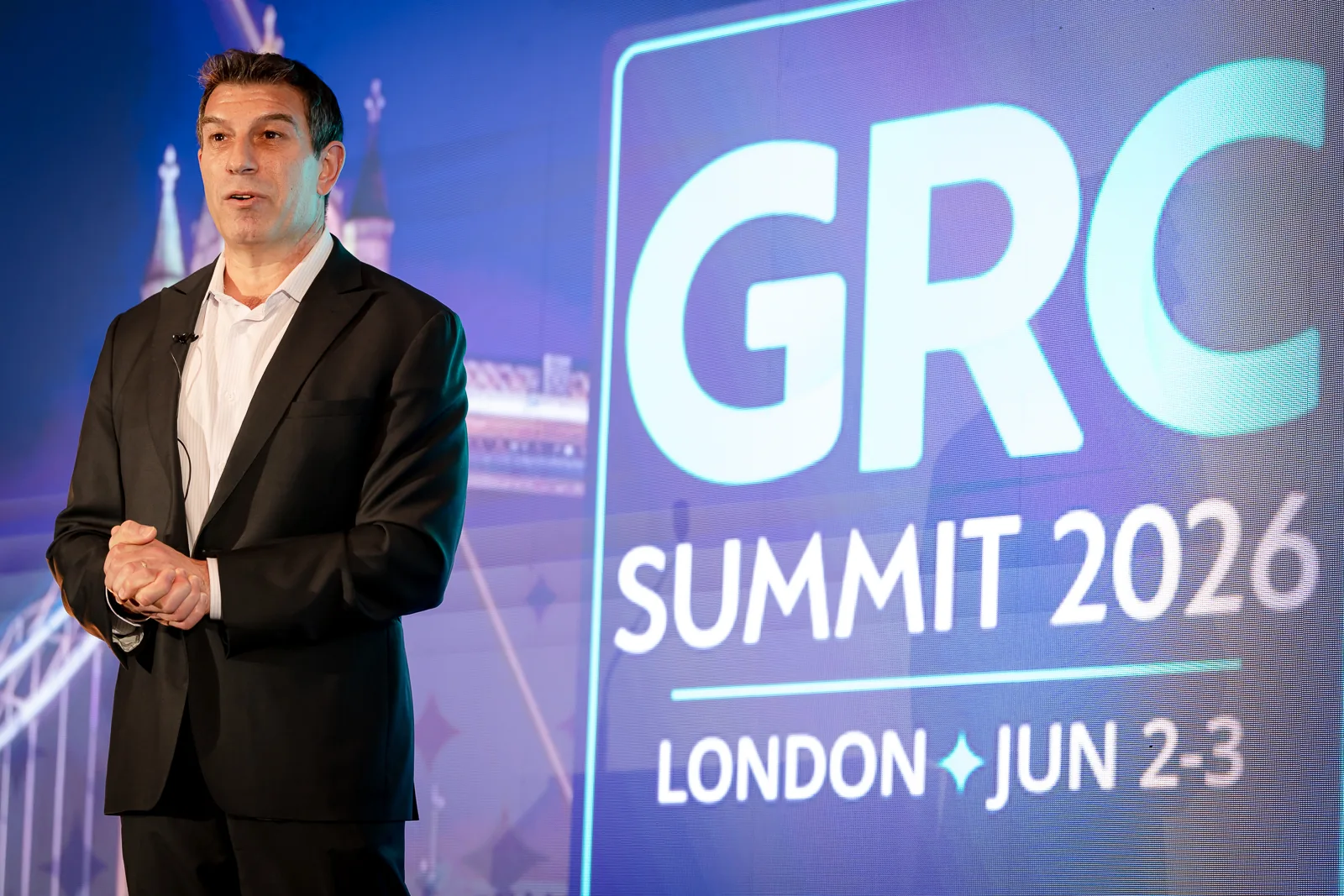 speaker-beside-12m-led-video-wall-grc-summit-london-2026