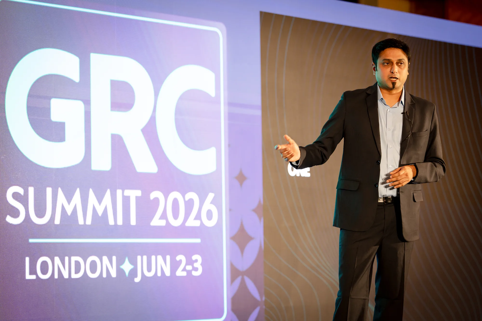 speaker-stage-led-wall-event-graphics-grc-summit-london-2026